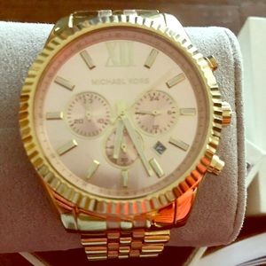 Michael Kors women’s rose gold watch.